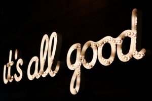 a lit sign that reads: "it's all good"