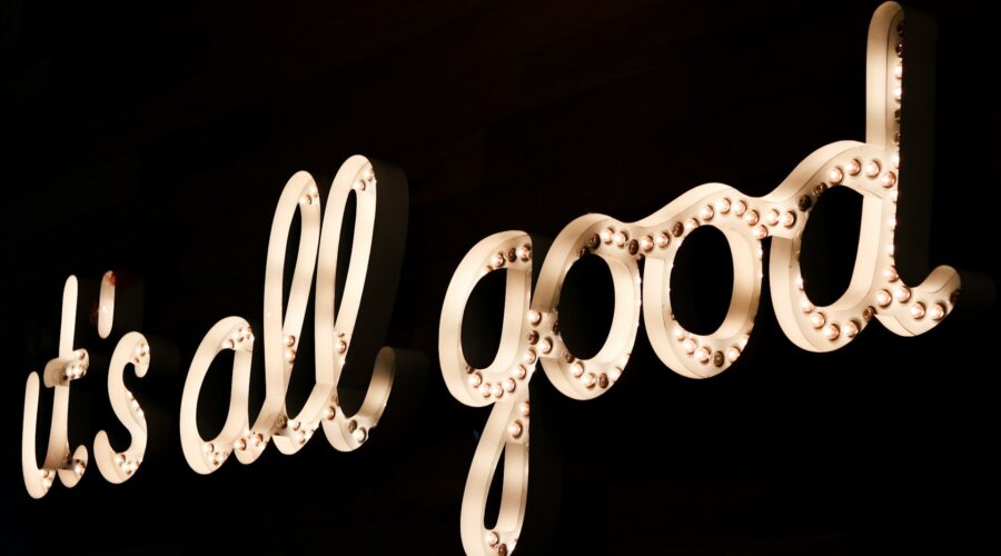 a lit sign that reads: "it's all good"