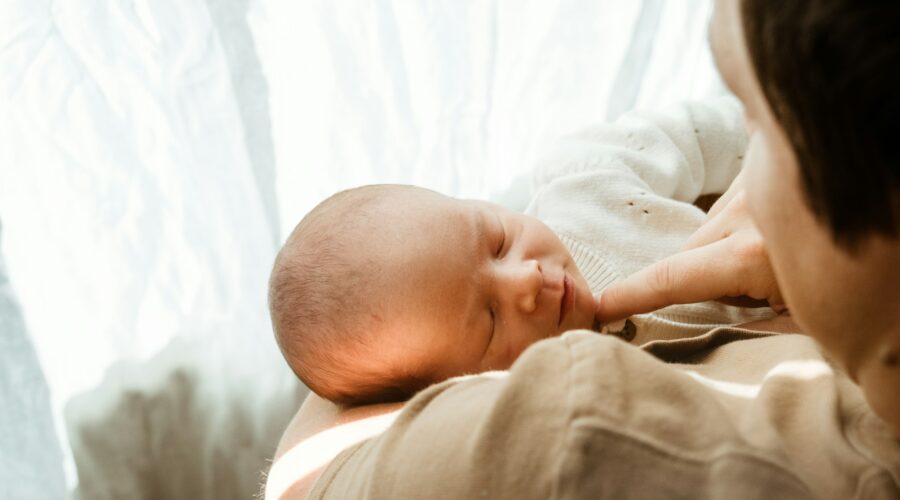 a person holding a baby