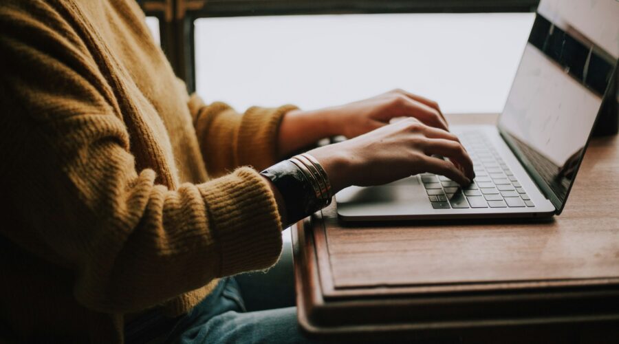 a person typing on a computer