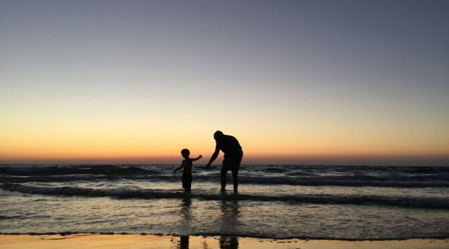 a man and kid in the water