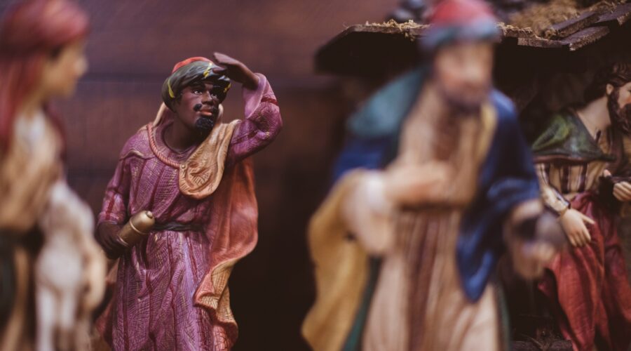 a closeup of a wise man in a nativity scene