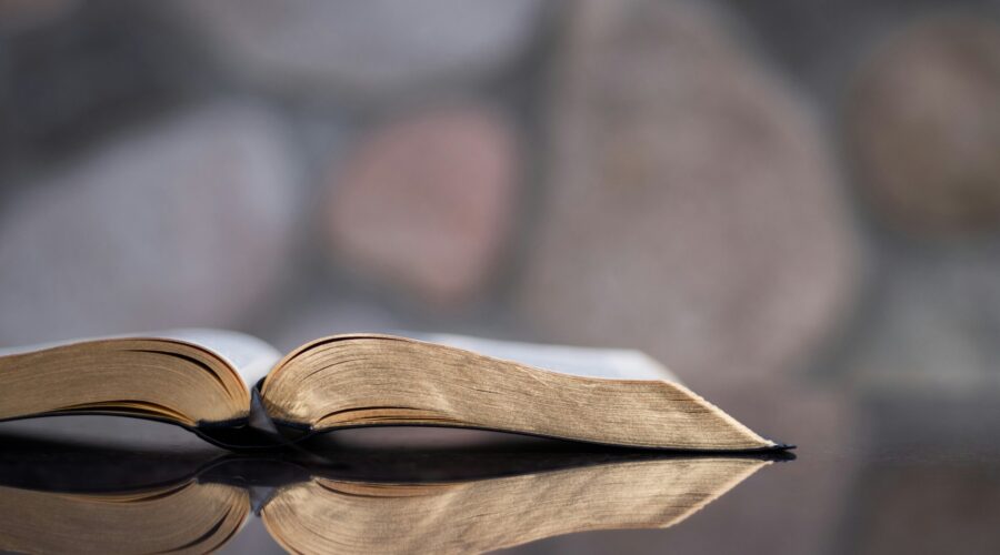 a photo of an open Bible on a table