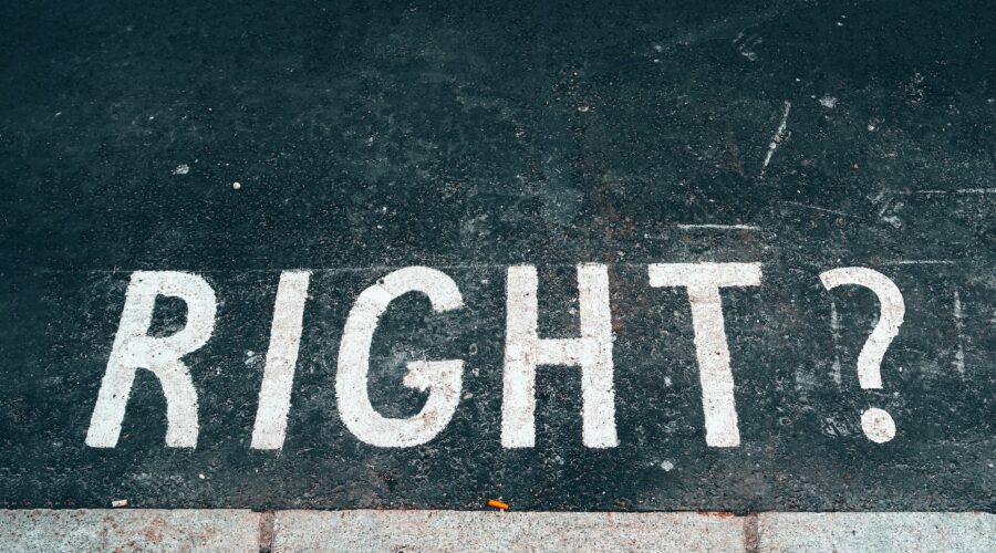 a photo of a street, with "RIGHT?" painted in white