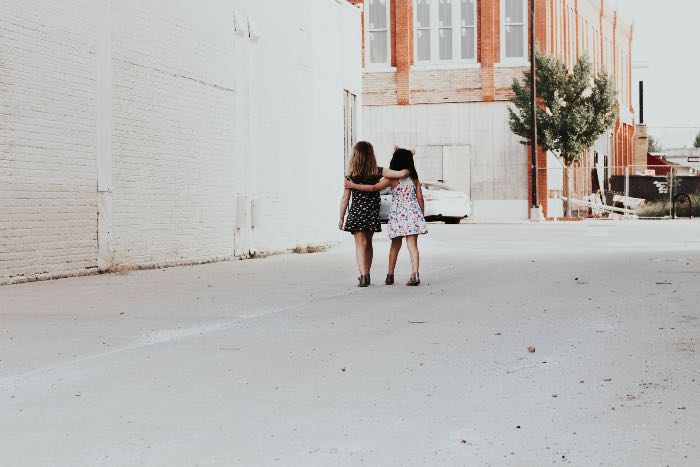 a photo of two girls walking