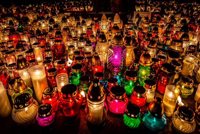 a photo of many colored lanterns, lit and glowing.